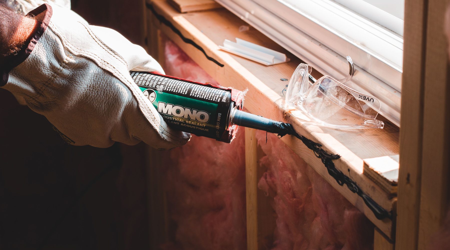 Close-up of sealant being applied during construction