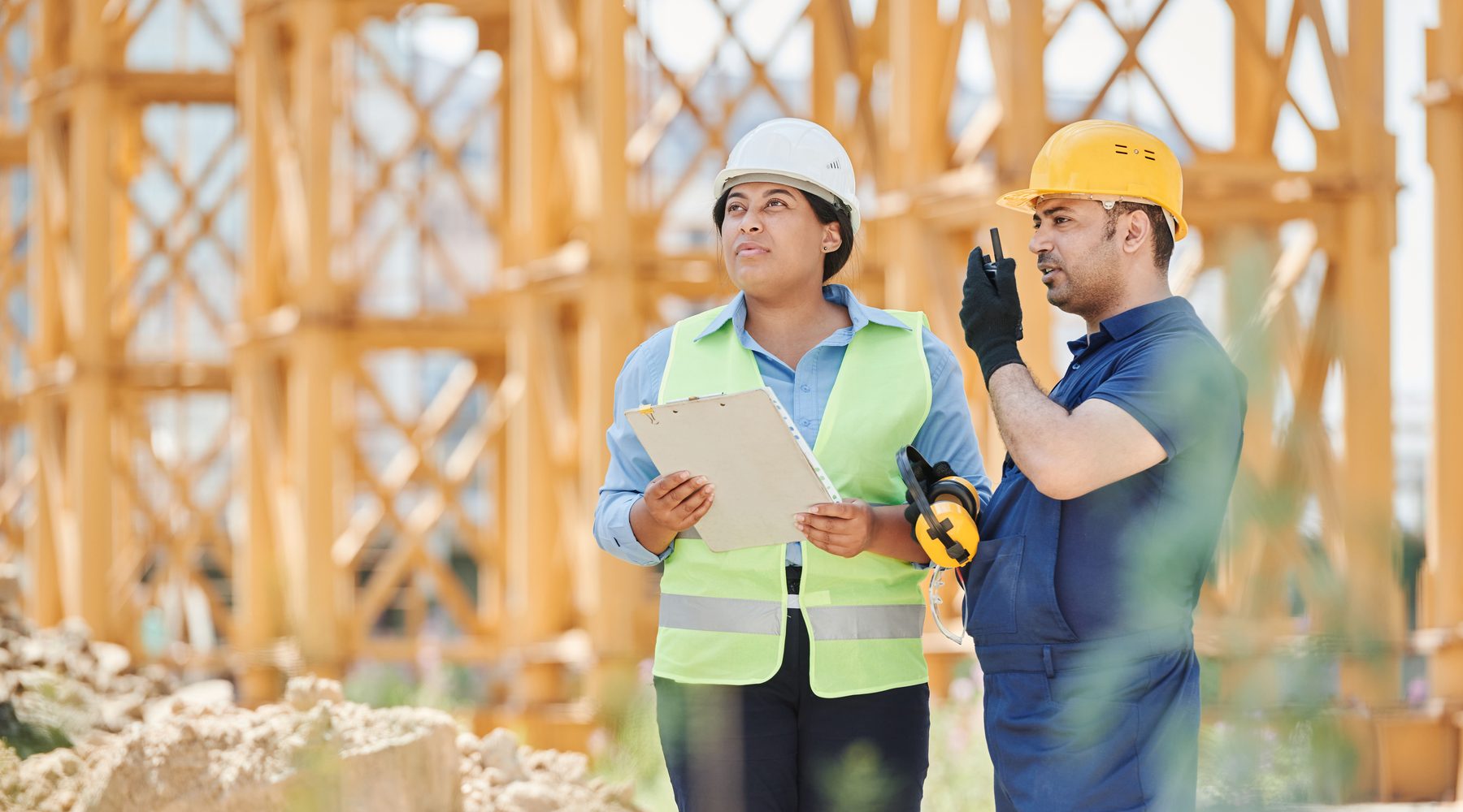 Construction professionals coordinating work at a jobsite